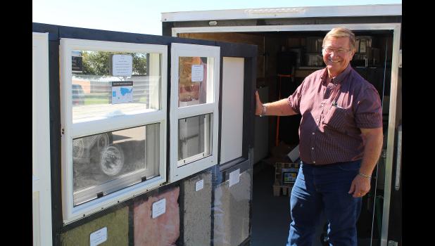 University of Missouri Extension specialist Bob Broz shows how to save money using a new mobile energy education unit. The classroom on wheels helps users view different types of doors, windows, insulation and lighting. Photo by Linda Geist