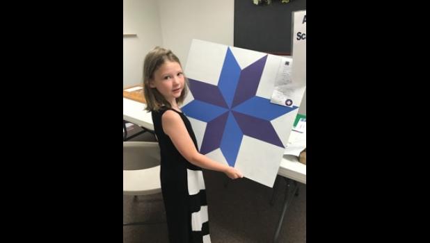 Kathryn exhibits one of her woodworking projects.