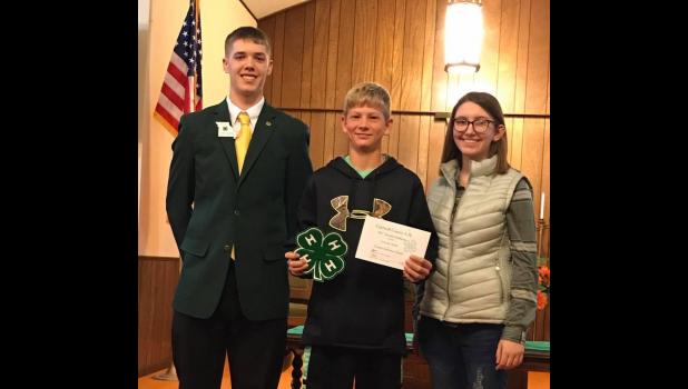 Toomay dedication award: L to R: Kyle Hanson NW Regional Rep, Losson Park- Toomay Dedication Award winner, Ryley Baragary- Caldwell County 4-H Council President
