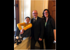 Senato Hoskins poses for a photo with Robyn Schelp and her son, Jacob. The Schelp family has been strong advocates for Senate Bill 45.