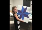 Kathryn exhibits one of her woodworking projects.