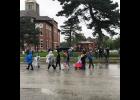 Many people showed up wearing their rain gear and toting their umbrellas for Kingston’s celebration. Photo by Eileen Gregory