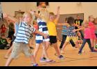 Local preschoolers learn dance moves.
