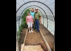Ozark Prairie Master Gardener Dan Britton, right, his wife, Earlene, left, and MU Extension specialist Joni Harper, center, are teaching other Master Gardeners how to make small greenhouses. Photo by Linda Geist